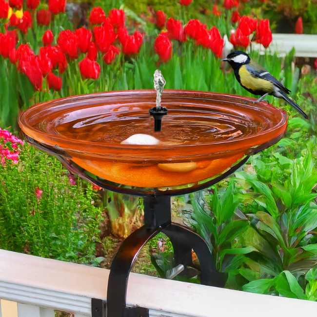 Handsome glass bird bath with a solar-powered bubbler and 18-inch spray height, perfect for adding elegance to your yard. Includes a deck mount stand for easy installation on railings or flat surfaces.
